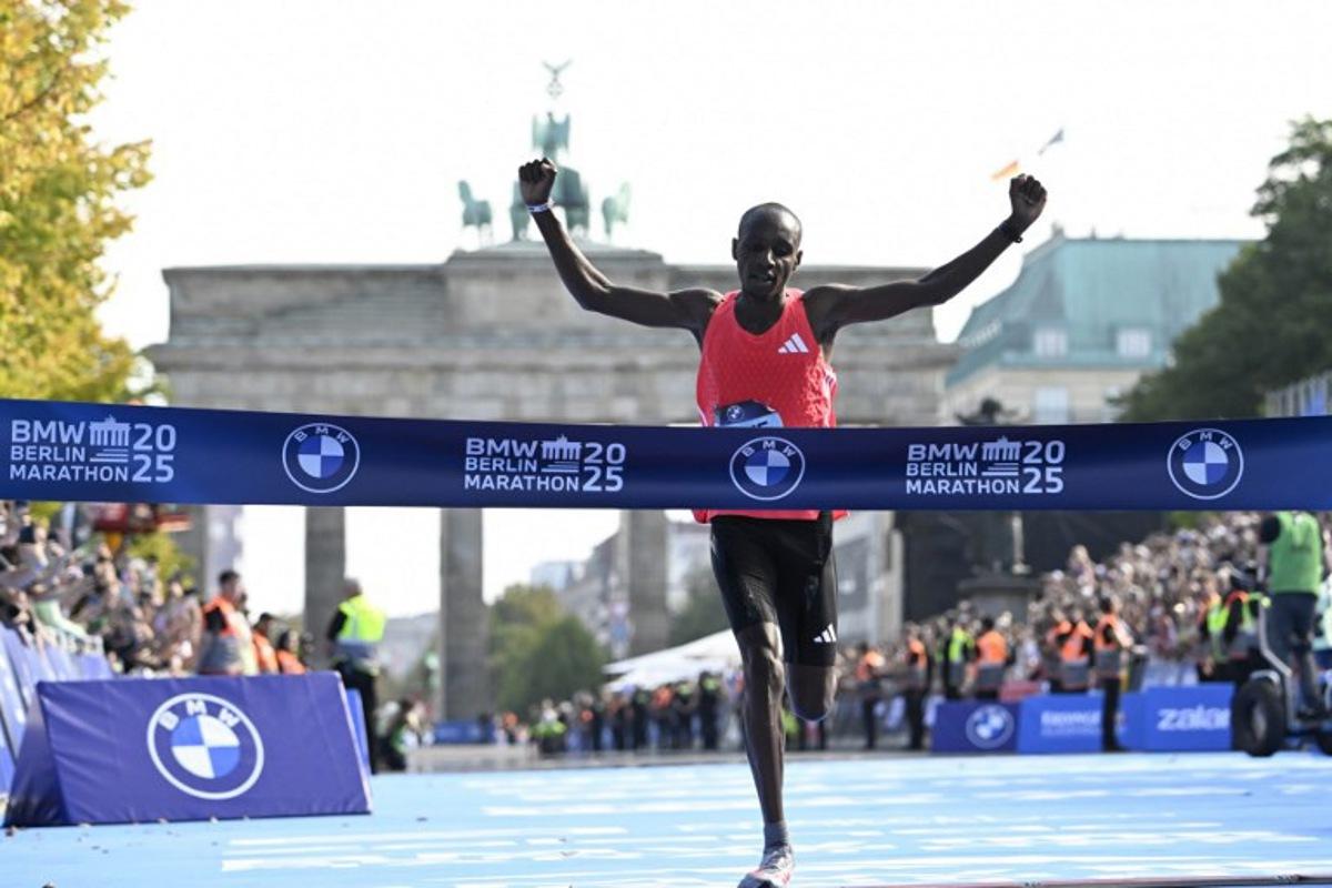 Kenya's Sabastian Sawe crosses the finish line to win the 51st edition of the Berlin Marathon in Berlin, Germany on September 21, 2025.  Tobias SCHWARZ / AFP