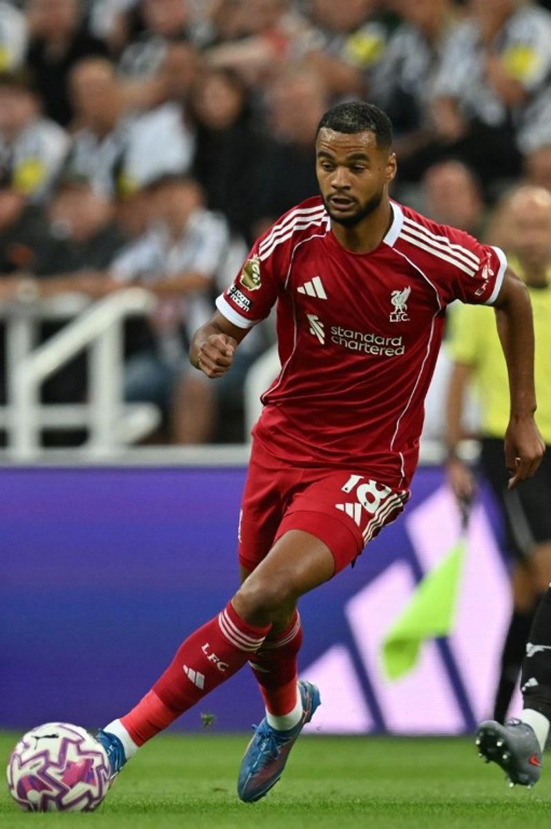 Liverpool's Dutch striker #18 Cody Gakpo runs with the ball during the English Premier League football match between Newcastle United and Liverpool at St James' Park in Newcastle-upon-Tyne, north east England on August 25, 2025.  ANDY BUCHANAN / AFP