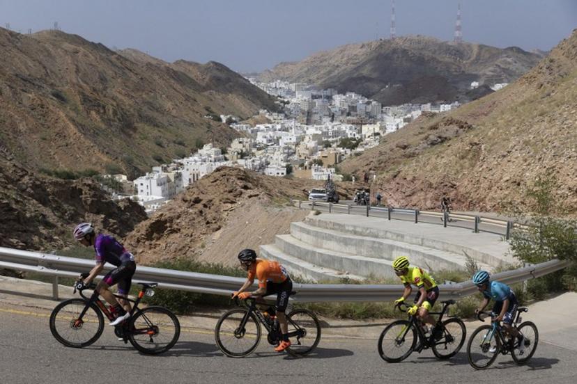 (L to R) Burgos BH's rider Victor Langellotti, Euskatel-Euskadi's Antonio Angulo Sampedro, Bingoal Pauwels Sauces WB's Johan Meens, and Astana Qazaqstan Team's Harold Martin Lopez Granizo ride during the sixth stage of the Oman Tour, between al-Mouj Muscat and Matrah Corniche, in Muscat on February 15, 2022.  Thomas SAMSON / AFP