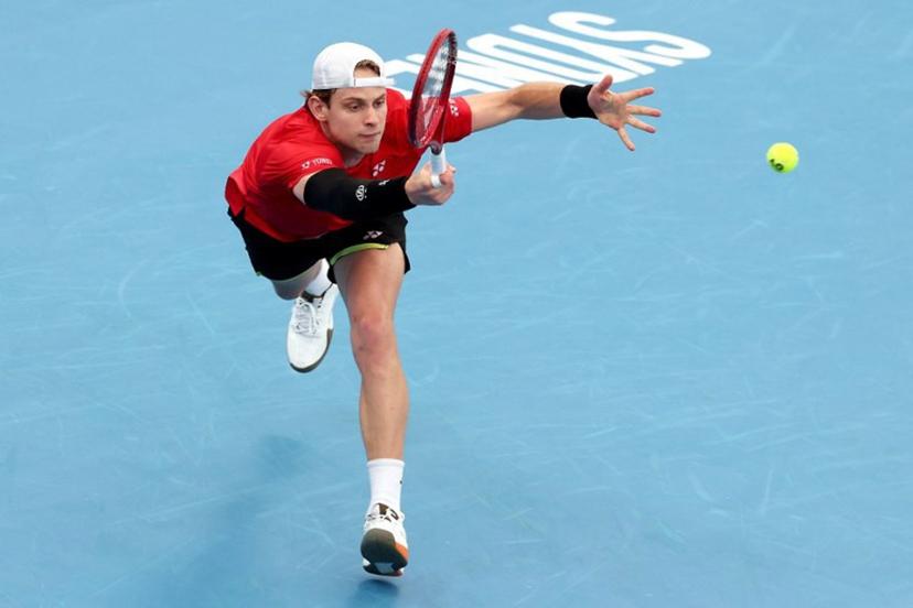 Belgium's Zizou Bergs hits a return to China's Zhang Zhizhen during their men's singles match at the United Cup tennis tournament on Ken Rosewall Arena in Sydney on January 3, 2026.  DAVID GRAY / AFP