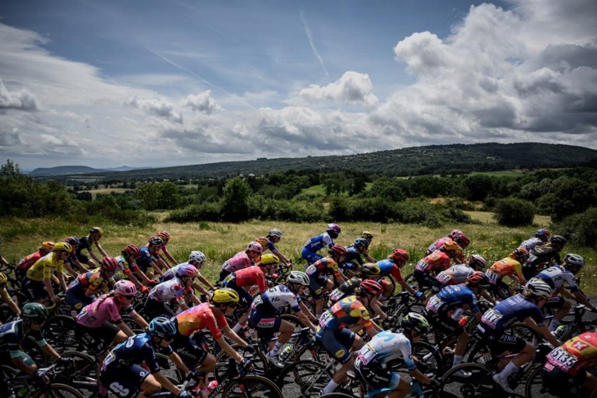 The pack rides during the second stage (out of 8) of the second edition of the Women's Tour de France cycling race 151 km between Clermont-Ferrand and Mauriac, in the Auvergne-Rhone-Alpes region, south-eastern France, on July 24, 2023.   JEFF PACHOUD / AFP