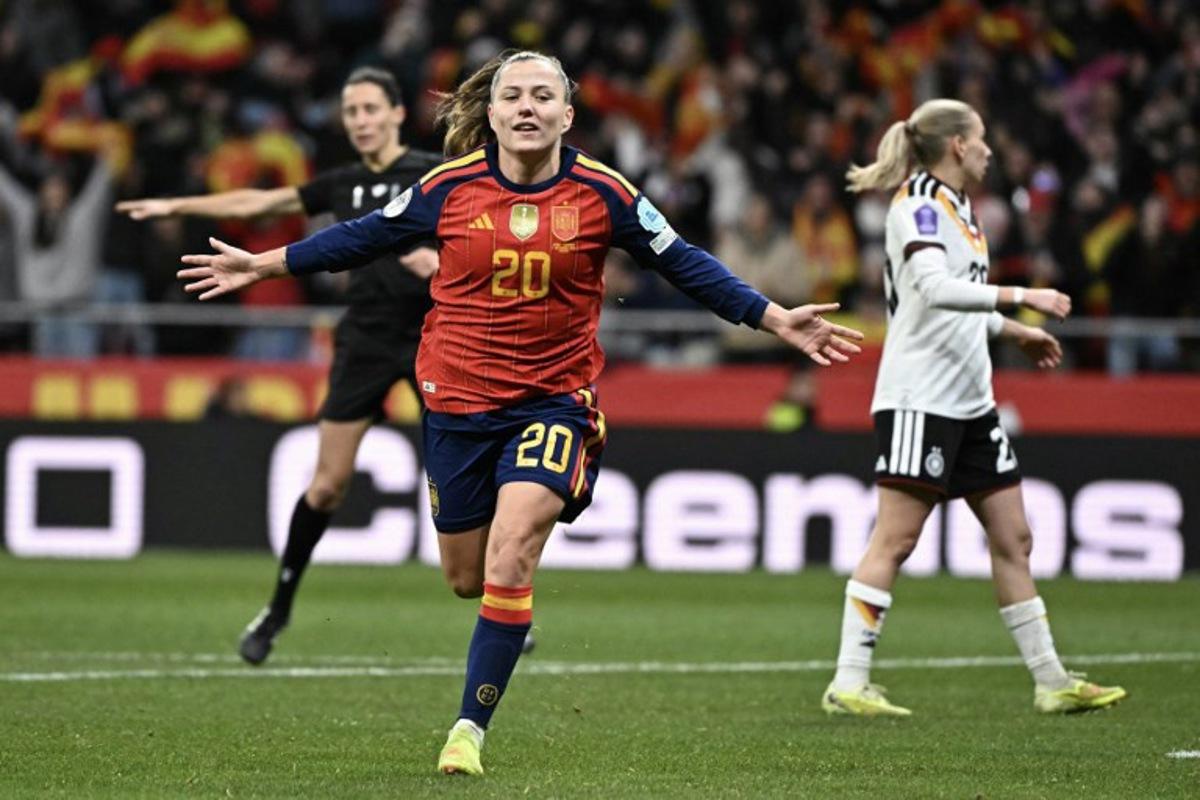 Spain's forward #20 Claudia Pina celebrates after scoring their third goal during the UEFA Women's Nations League second leg final football match between Spain and Germany at the Metropolitano Stadium in Madrid on December 2, 2025.  Javier SORIANO / AFP