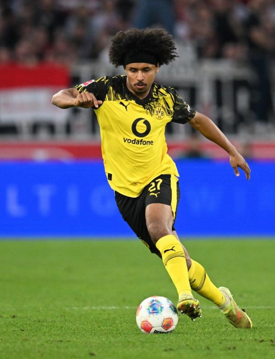Dortmund's German forward #27 Karim Adeyemi plays the ball during the German first division Bundesliga football match between VfB Stuttgart and BVB Borussia Dortmund in Stuttgart, southern Germany, on April 4, 2026.  THOMAS KIENZLE / AFP