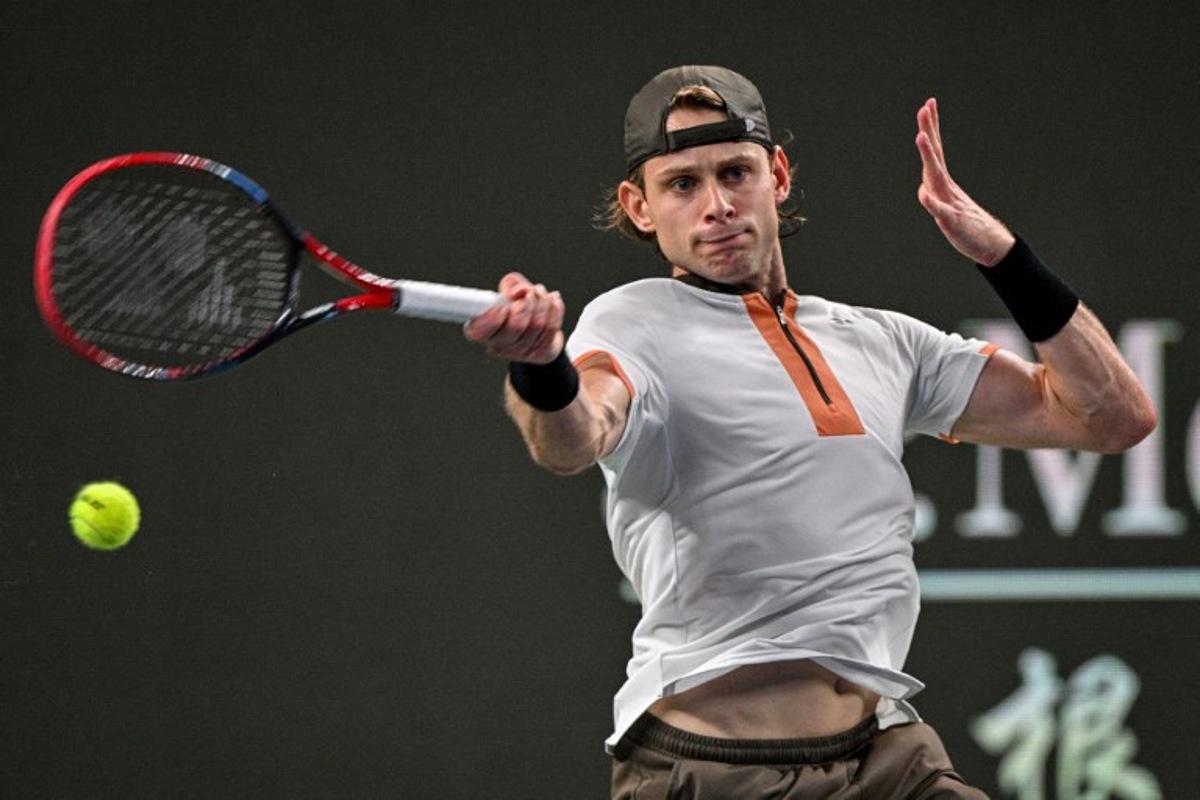 Belgium's Zizou Bergs hits a return to Serbia's Novak Djokovic during their quarter-final men's singles match at the Shanghai Masters tennis tournament in Shanghai on October 9, 2025.  Hector RETAMAL / AFP