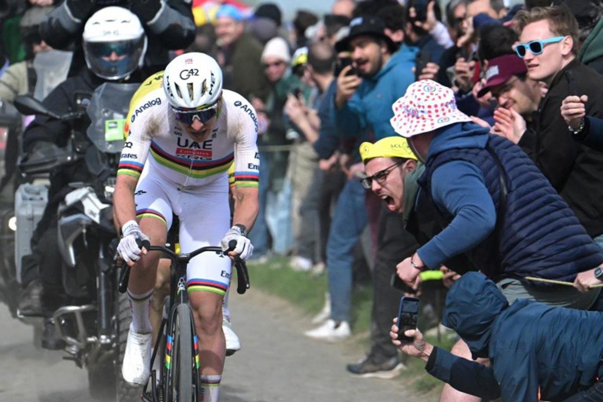 UAE Team Emirates XRG's Slovenian rider Tadej Pogacar cycles in a breakaway on a cobblestone sector during the 123rd edition of the Paris-Roubaix one-day classic cycling race, 258.3 km between Compiègne and Roubaix, northern France, on April 12, 2026.   Bernard PAPON / POOL / AFP