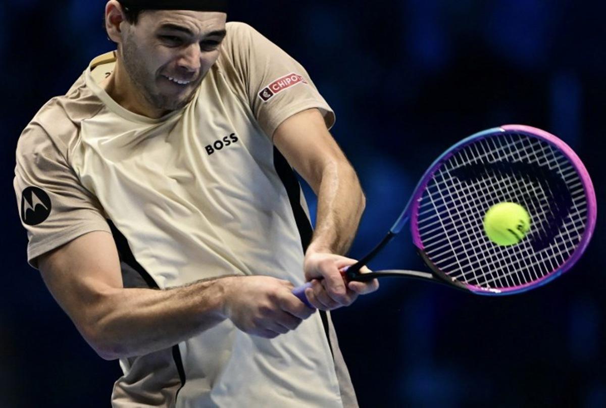 USA's Taylor Fritz plays a backhand return against Italy's Lorenzo Musetti during the ATP Finals tennis tournament in Turin on November 10, 2025. bac Marco BERTORELLO / AFP