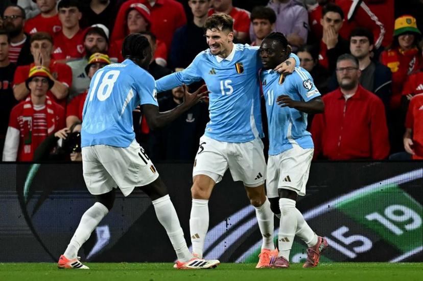 Belgium's defender #15 Thomas Meunier (C) celebrates scoring the team's second goal during the 2026 World Cup Group J qualifier football match between Wales and Belgium, at Cardiff City Stadium, in Cardiff, on October 13, 2025.   Paul ELLIS / AFP