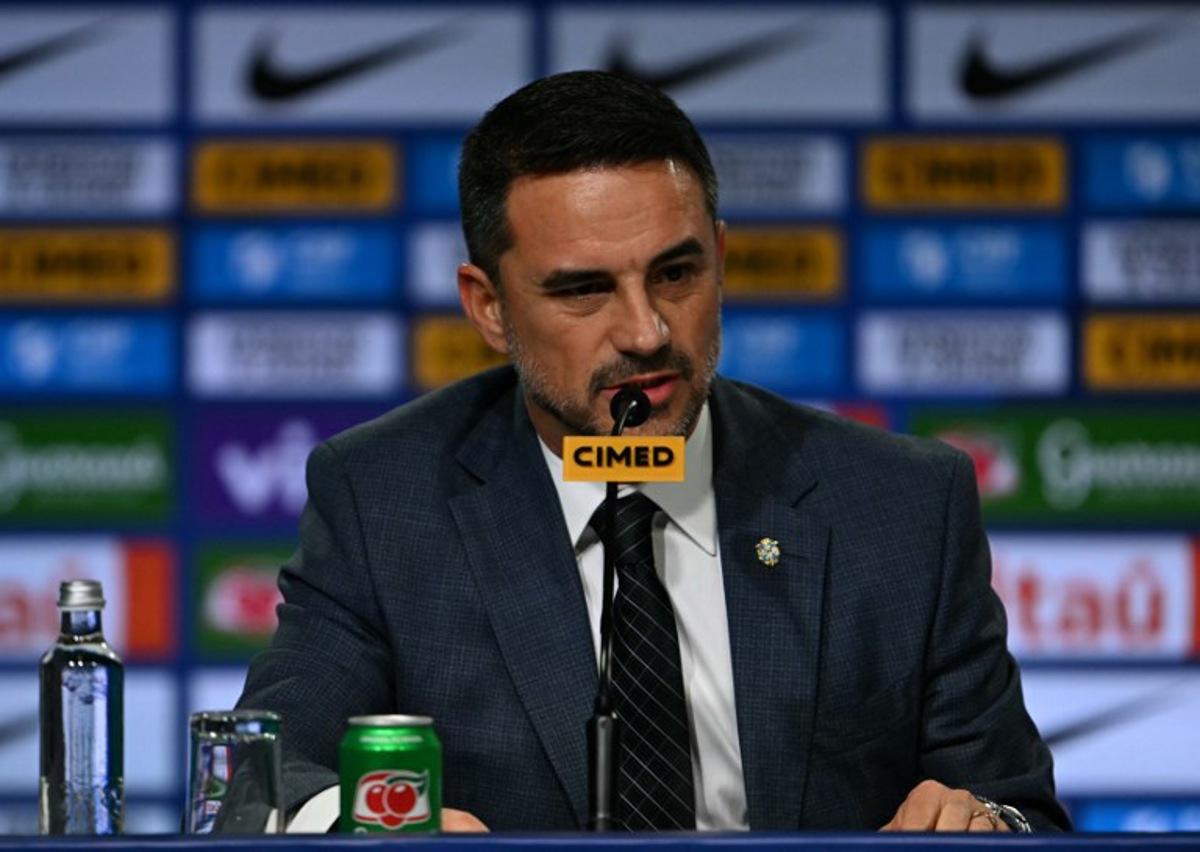 The president of the Brazilian Football Confederation (CBF) Samir Xaud speaks during the presentation of Brazil's football team new head coach, Italian Carlo Ancelotti (out of frame), at a hotel in Barra da Tijuca neighbourhood, Rio de Janeiro, Brazil, on May 26, 2025.   Mauro PIMENTEL / AFP