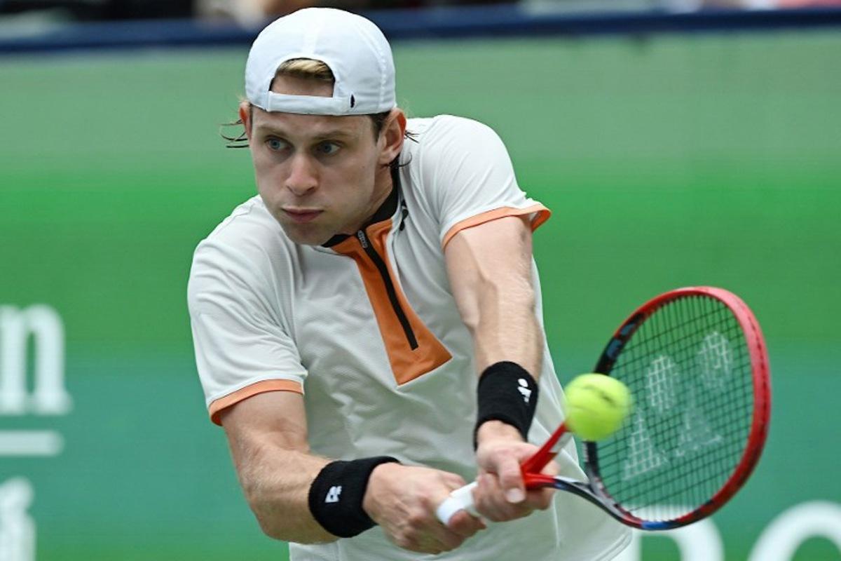Belgium's Zizou Bergs hits a return to Canada's Gabriel Diallo during their men's singles match at the Shanghai Masters tennis tournament in Shanghai on October 7, 2025.  Jade Gao / AFP