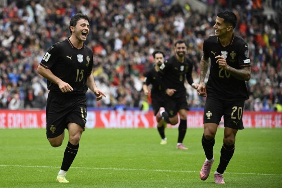 Portugal's midfielder #15 Joao Neves celebrates his team's fourth goal during the 2026 World Cup qualifiers Europe zone group F football match between Portugal and Armenia, at Dragao stadium in Porto on November 16, 2025.   Miguel RIOPA / AFP