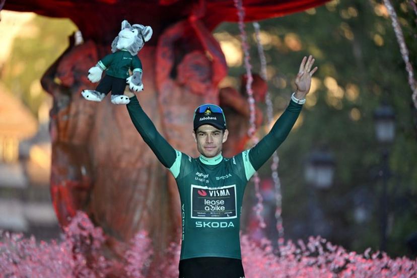 Team Visma-Lease a bike's Belgian rider Wout van Aert celebrates on the podium wearing the points leader's green jersey after the Vuelta a Espana 2026 cycling tour, a race over 3.275 kms in 21 stages and ending in Granada, on September 13, 2026.   JORGE GUERRERO / AFP