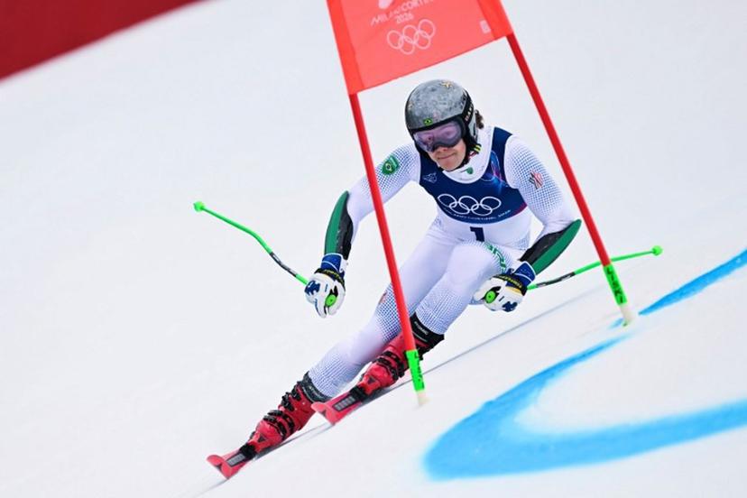 Brazil's Lucas Pinheiro Braathen passes a gate in the first run of the men's giant slalom alpine skiing event during the Milano Cortina 2026 Winter Olympic Games at the Stelvio Ski Centre in Bormio (Valtellina) on February 14, 2026.  Fabrice COFFRINI / AFP
