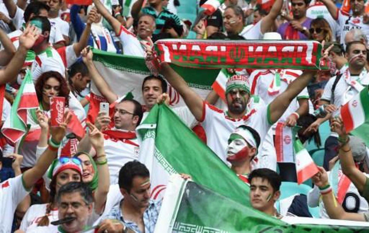 Fans of Iran react during a Group F football match between Bosnia-Hercegovina and Iran at the Fonte Nova Arena in Salvador during the 2014 FIFA World Cup on June 25, 2014.  AFP PHOTO / JAVIER SORIANO FOR EDITORIAL REPORTS, NO ALERT/PUSH TO MOBILE

