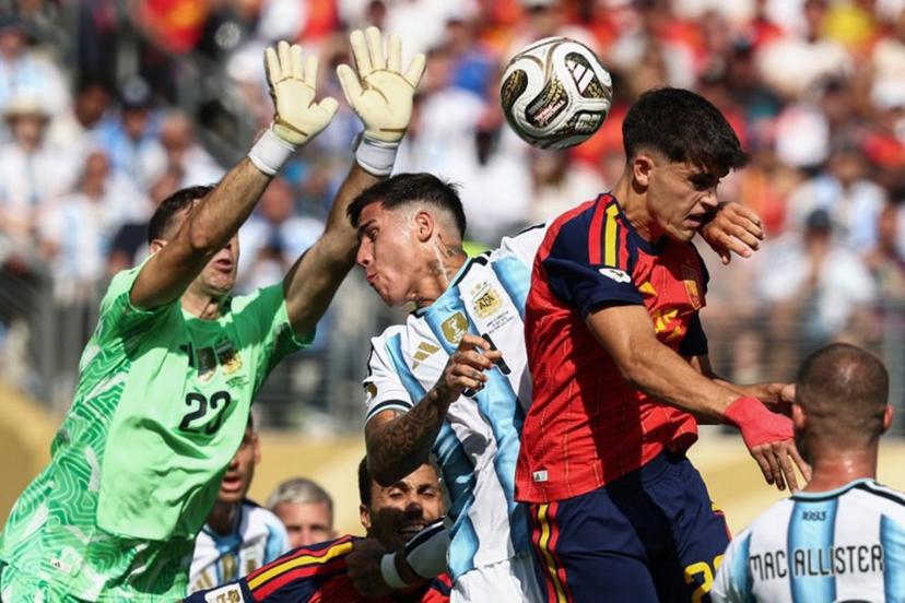 Argentina's midfielder #24 Enzo Fernandez and Spain's defender #22 Pau Cubarsi fight for the ball past Argentina's goalkeeper #23 Emiliano Martinez during the 2026 World Cup football tournament final match between Spain and Argentina at the New York/New Jersey Stadium in East Rutherford on July 19, 2026.   FRANCK FIFE / AFP