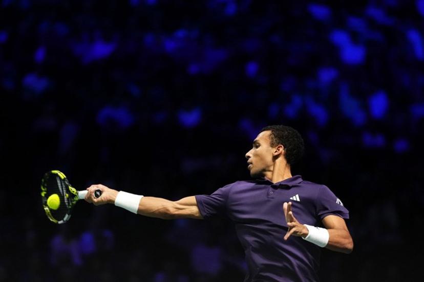 Canada's Felix Auger-Aliassime plays a forehand return to Kazakhstan's Alexander Bublik during their men's singles semi-final match on day six of the Paris ATP Masters 1000 tennis tournament at the Paris La Défense Arena in Nanterre, on the outskirts of Paris, on November 1, 2025.  Dimitar DILKOFF / AFP