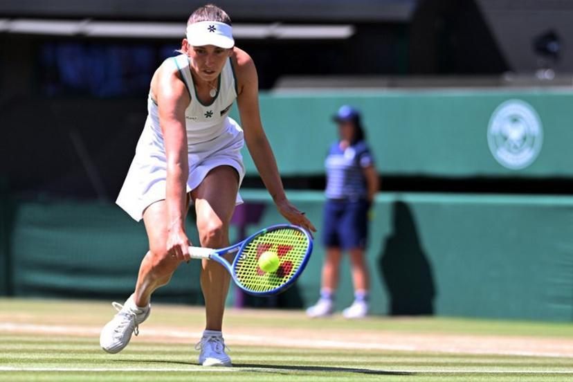 Belgium's Elise Mertens returns to Czech Republic's Linda Noskova during their women's singles quarter-final tennis match on the tenth day of the 2026 Wimbledon Championships at The All England Lawn Tennis and Croquet Club in Wimbledon, southwest London, on July 8, 2026.  Kirill KUDRYAVTSEV / AFP