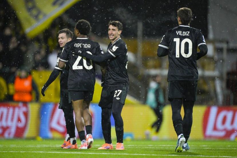 Juventus' Belgian forward #20 Lois Openda (L) celebrates with Juventus' Italian defender #27 Andrea Cambiaso celebrates after scoring the equalising goal during the UEFA Champions League football match between Bodoe/Glimt and Juventus Turin in Bodoe, on November 25, 2025.  Stian Lysberg Solum / NTB / AFP