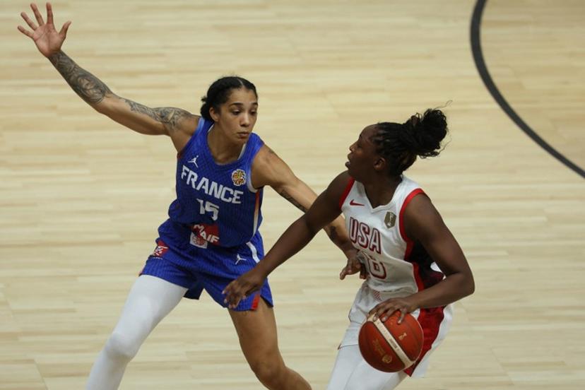 France's forward #15 Gabby Williams and USA's guard #08 Chelsea Gray vie for the ball during the 2026 FIBA Women's Basketball World Cup final game between the United States and France in Berlin on September 13, 2026.  Odd ANDERSEN / AFP