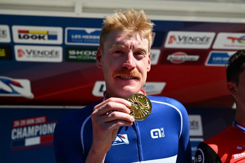 Decathlon-AG2R La Mondiale's French rider Dorian Godon poses with his medal after winning the men's Elite race of the French National Road Cycling championships, in Les Herbiers, western France, on June 29, 2025.  Sebastien Salom-Gomis / AFP