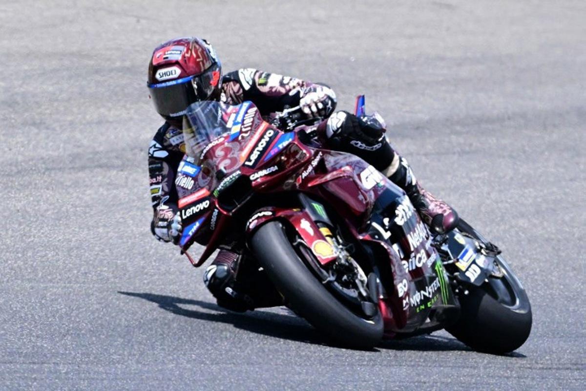 Ducati Lenovoi Team's Spanish MotoGP rider Marc Marquez steers his motorbike during the Italian Moto GP Grand Prix at Mugello circuit, in Mugello, near Florence, on June 22, 2025.   Tiziana FABI / AFP