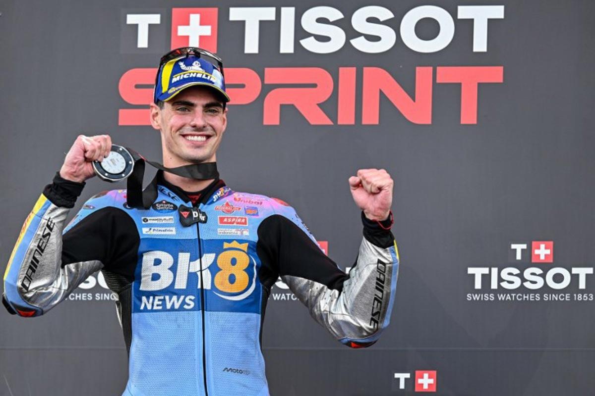 Second-placed BK8 Gresini Racing MotoGP team's Spanish MotoGP rider Fermin Aldeguer celebrates on the podium after the Sprint Race at the MotoGP Indonesian Grand Prix at the Mandalika International Circuit in Mandalika, West Nusa Tenggara on October 4, 2025.  SONNY TUMBELAKA / AFP