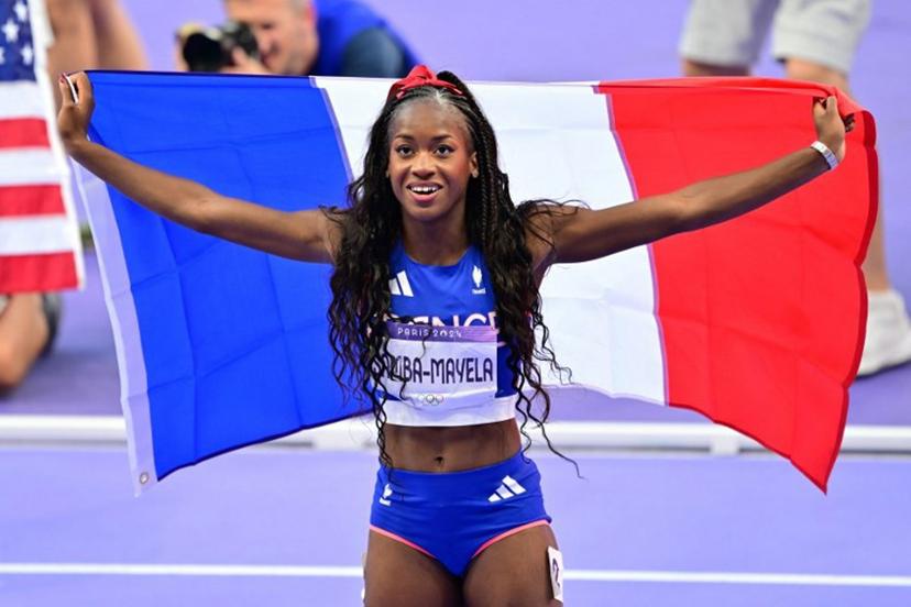 Silver medallist France's Cyrena Samba-Mayela celebrates after the women's 100m hurdles final of the athletics event at the Paris 2024 Olympic Games at Stade de France in Saint-Denis, north of Paris, on August 10, 2024.  Martin  BERNETTI / AFP