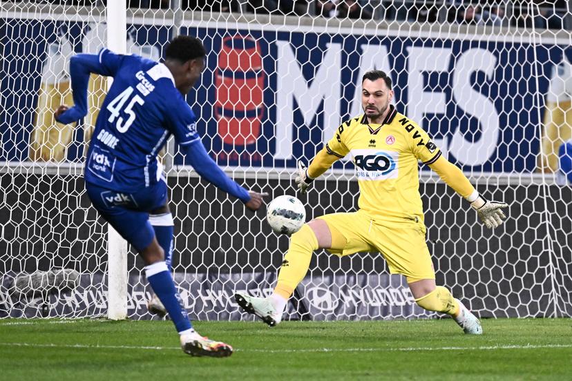 Gent's Hyllarion Goore and Kortrijk's goalkeeper Lucas Pirard fight for the ball during a soccer game between KAA Gent and KV Kortrijk, Sunday 16 March 2025 in Gent, on day 30 of the 2024-2025 season of the "Jupiler Pro League" first division of the Belgian championship. BELGA PHOTO MAARTEN STRAETEMANS