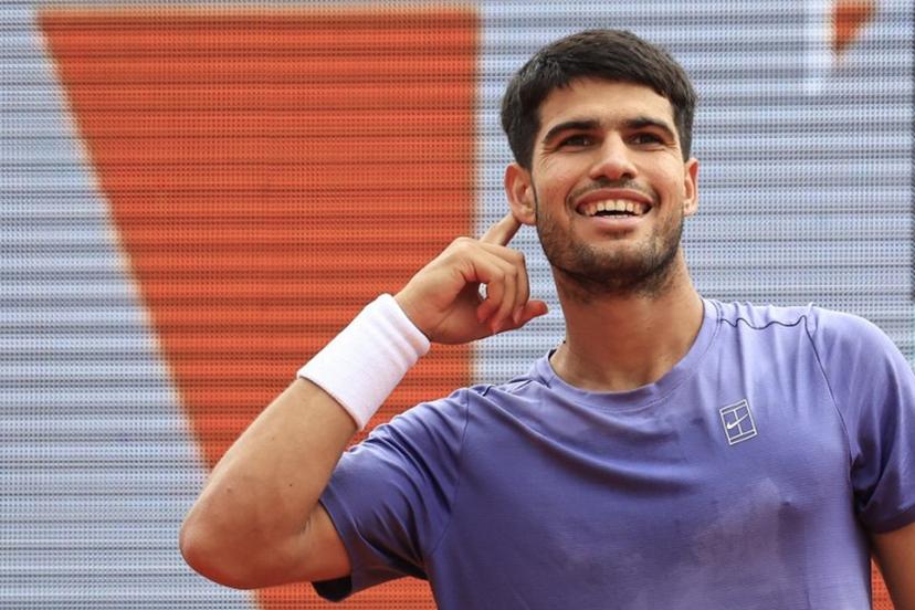 Spain's Carlos Alcaraz reacts after a point as he plays against Italy's Lorenzo Musetti during the Monte Carlo ATP Masters Series Tournament final tennis match at the Monte Carlo Country Club in Roquebrune-Cap-Martin on April 13, 2025.  Valery HACHE / AFP