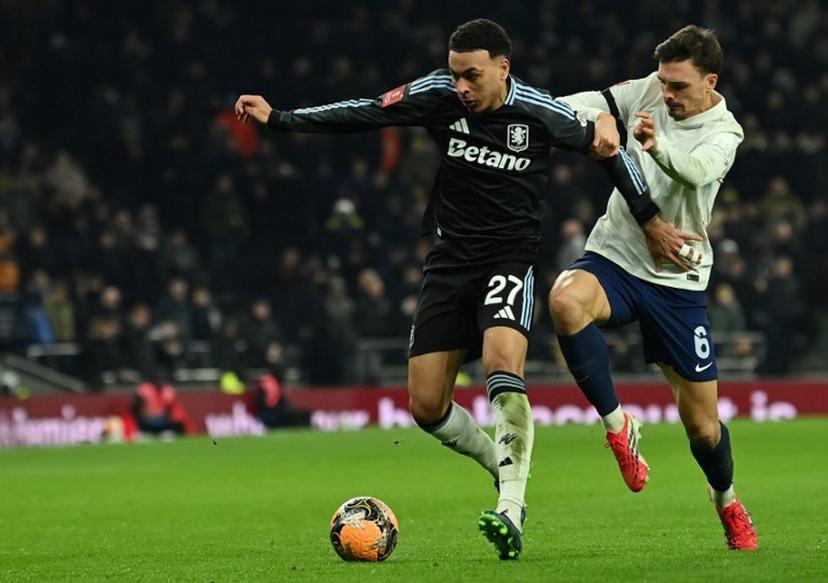 Tottenham Hotspur's Portugese midfielder #06 Joao Palhinha (R) vies with Aston Villa's English midfielder #27 Morgan Rogers during the English third round FA Cup football match between Tottenham Hotspur and Aston Villa at Tottenham Hotspur Stadium in London, on January 10, 2026.  Glyn KIRK / AFP