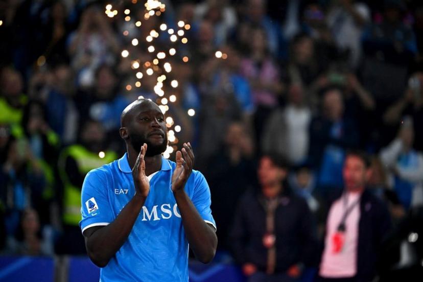 Napoli's Belgian forward #11 Romelu Lukaku applauds ahead of the trophy ceremony for the Italian Champions following the Italian Serie A football match between Napoli and Cagliari at the Diego Armando Maradona stadium in Naples on May 23, 2025.  Isabella BONOTTO / AFP