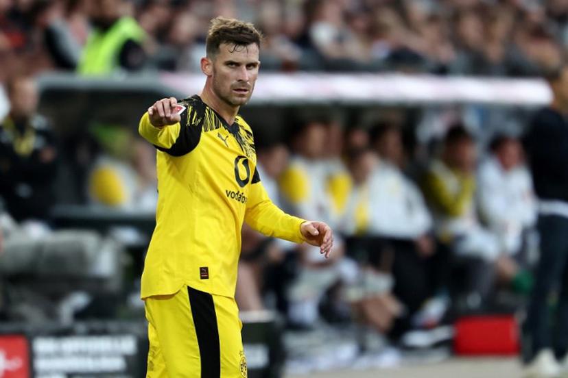 Dortmund's German midfielder #13 Pascal Gross gestures during the German first division Bundesliga football match between FC St Pauli and Borussia Dortmund in Hamburg, northern Germany on August 23, 2025.  IBRAHIM OT / AFP