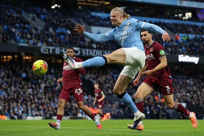 Manchester City's Norwegian striker #09 Erling Haaland shoots but misses a chance during the English Premier League football match between Manchester City and West Ham United at the Etihad Stadium in Manchester, north west England, on December 20, 2025.  Darren Staples / AFP