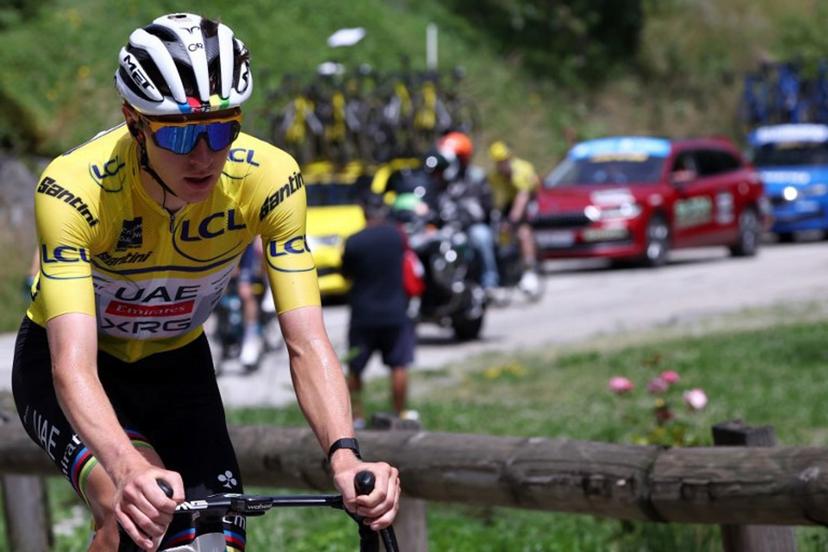 UAE Team Emirates XRG's Slovenian rider Tadej Pogačar wearing the overall leader's yellow jersey cycles during the 7th stage of the 77th edition of the Criterium du Dauphine cycling race, 131,6 km between Grand-Aigueblanche and Valmeinier, on June 14, 2025.  Anne-Christine POUJOULAT / AFP