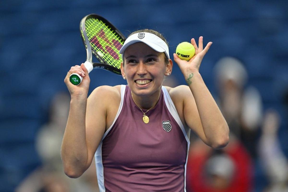Belgium's Elise Mertens reacts as she celebrates her victory against USA's Coco Gauff during their women's singles match at the China Open tennis tournament in Beijing on October 7, 2026.   Adek BERRY / AFP