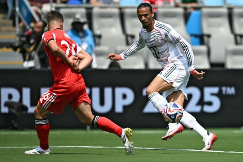 Bayern Munich's German midfielder #10 Leroy Sane (R) controls the ball in front of Benfica's Argentine forward #25 Gianluca Prestianni during the FIFA Club World Cup 2025 Group C football match between Portugal's Benfica and Germany's Bayern Munich at the Bank of America stadium in Charlotte on June 24, 2025.  Paul ELLIS / AFP