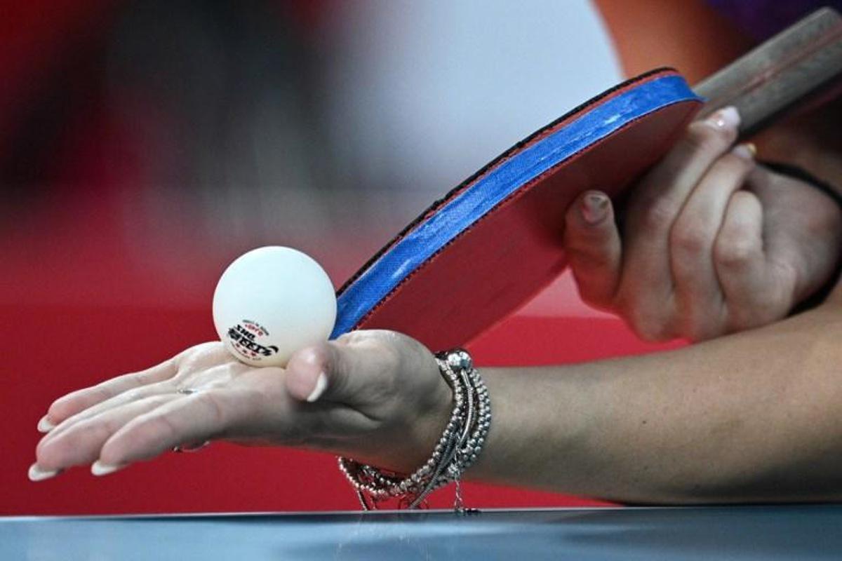Romania's Bernadette Szocs serves to USA's Juan Liu during her women's singles round 3 table tennis match at the Tokyo Metropolitan Gymnasium during the Tokyo 2020 Olympic Games in Tokyo on July 27, 2021.  Anne-Christine POUJOULAT / AFP