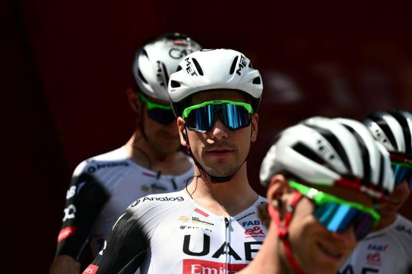 Team UAE's Portuguese rider Joao Almeida prepares to take the start of the third stage of the Vuelta a Espana, a 134 km race between San Maurizio Canavese and Ceres, in Italy's Piemonte region, on August 25, 2025.    Marco BERTORELLO / AFP