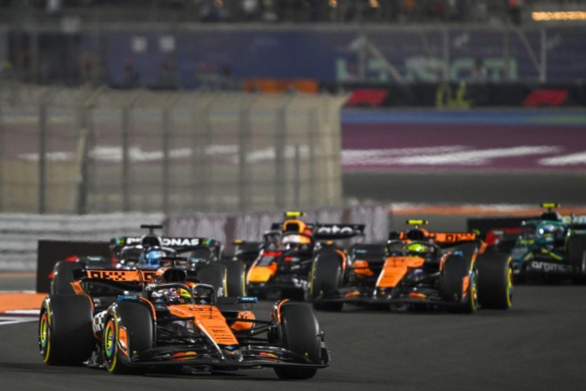 McLaren's Australian driver Oscar Piastri leads the pack during sprint race ahead of the Formula One Qatar Grand Prix at the Lusail International Circuit in Lusail on November 29, 2025.  Mahmud HAMS / AFP