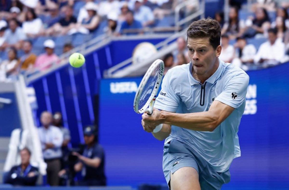 Belgium's Alexander Blockx hits a return to Argentina's Francisco Cerundolo during their men's singles round of 16 tennis match on day nine of the US Open tennis tournament at the USTA Billie Jean King National Tennis Center in New York on September 7, 2026.  kena betancur / AFP
