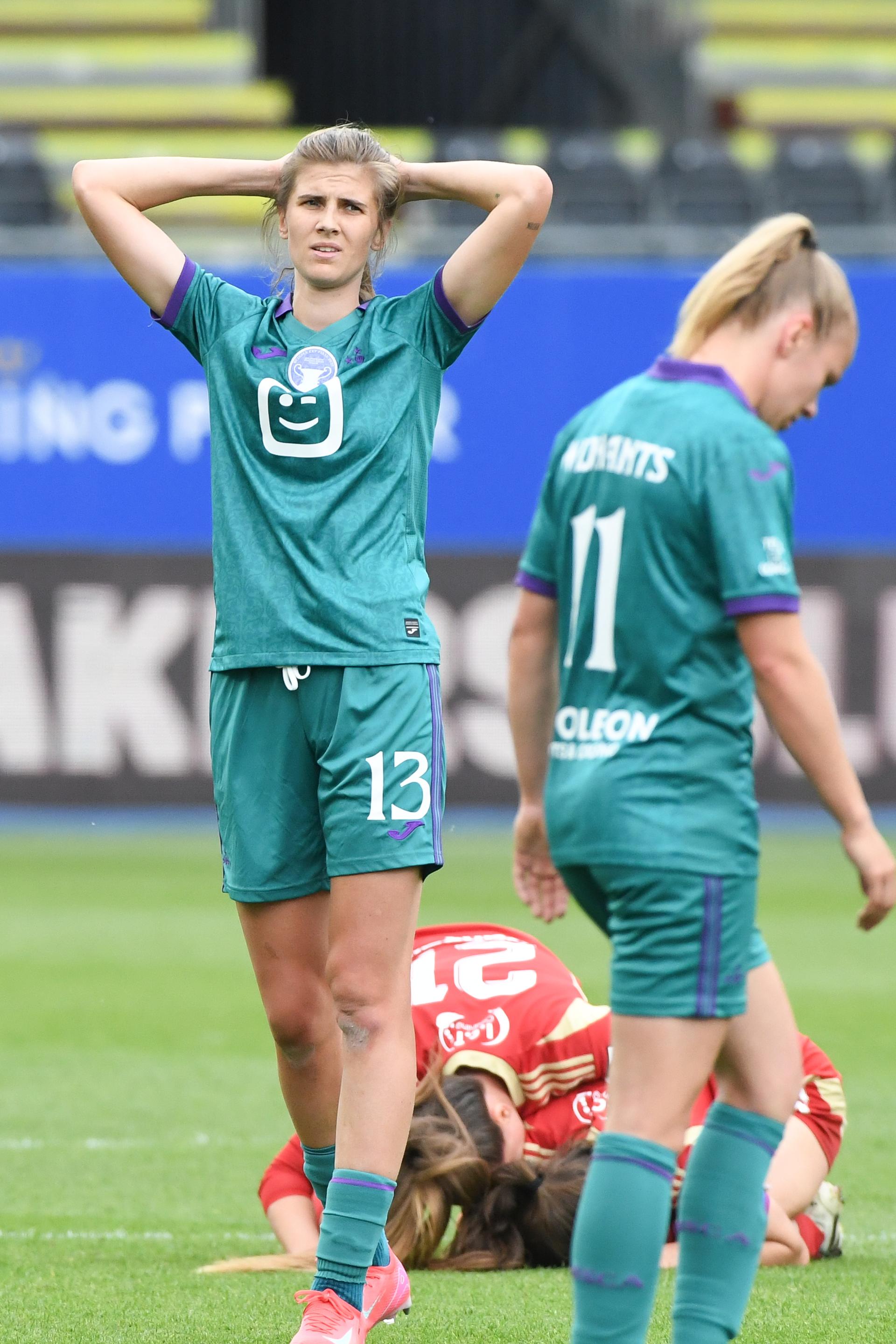 Anderlecht's Marie Minnaert and Anderlecht's Sarah Wijnants look dejected after losing a soccer match between RSC Anderlecht and Standard Femina de Liege, the final of the Belgian Cup, in Heverlee, Monday 21 April 2025. BELGA PHOTO JILL DELSAUX