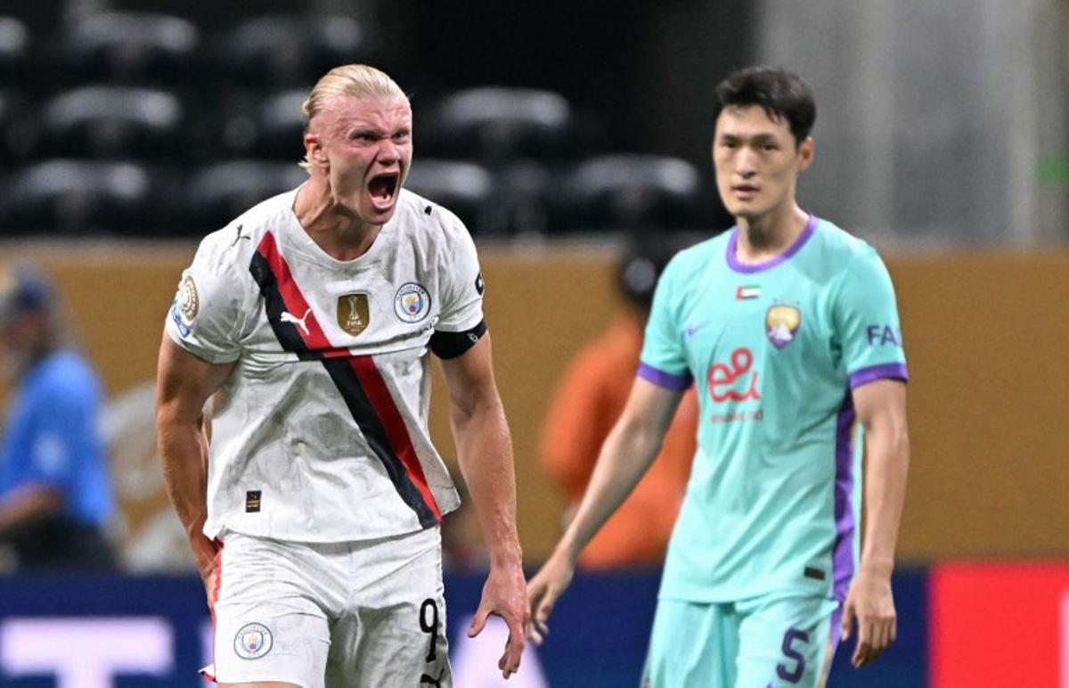 Manchester City's Norwegian striker #09 Erling Haaland reacts next to Al Ain's South Korean defender #05 Park Yongwoo at the end of the FIFA Club World Cup 2025 Group G football match between England's Manchester City and UAE's Al Ain FC at the Mercedes-Benz stadium in Atlanta on June 22, 2025.  PATRICIA DE MELO MOREIRA / AFP