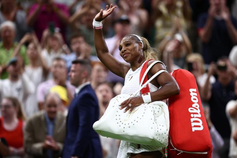 US player Serena Williams waves as he leaves the court after being defeated by Australia's Maya Joint during their women's singles first round tennis match on the second day of the 2026 Wimbledon Championships at The All England Lawn Tennis and Croquet Club in Wimbledon, southwest London, on June 30, 2026.  Henry NICHOLLS / AFP