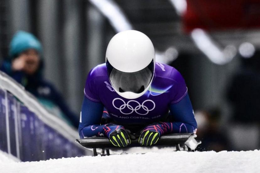 Britain's Tabitha Stoecker arrives to the finish area in the skeleton women's heat 3 at Cortina Sliding Centre during the Milano Cortina 2026 Winter Olympic Games in Cortina d'Ampezzo on February 14, 2026.  Stefano RELLANDINI / AFP