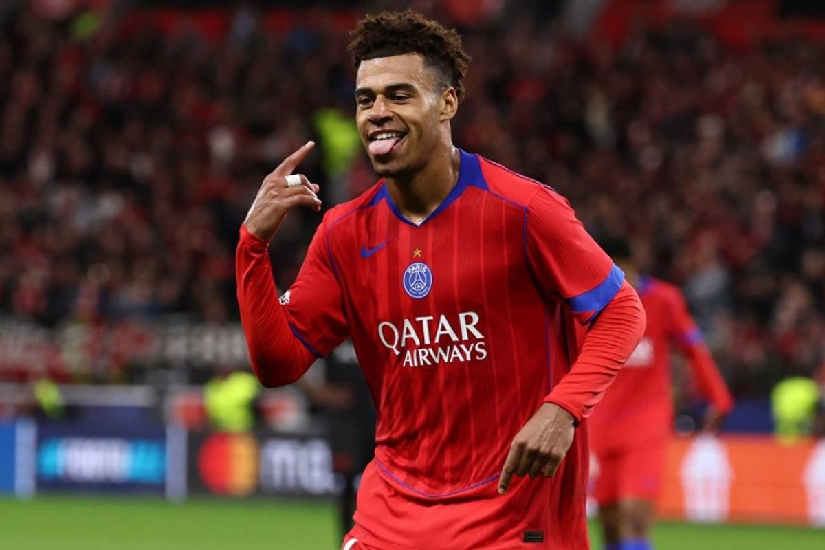 Paris Saint-Germain's French midfielder #14 Desire Doue celebrates scoring the 1-4 goal during the UEFA Champions League football match between Bayer 04 Leverkusen and Paris Saint-Germain (PSG) at the BayArena stadium in Leverkusen, western Germany on October 21, 2025.  FRANCK FIFE / AFP