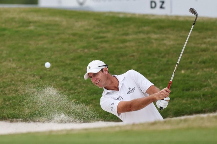 Nicolas Colsaerts of Belgium hits a shot from a bunker during the China Open golf tournament in Shanghai on April 17, 2025.  STR / AFP