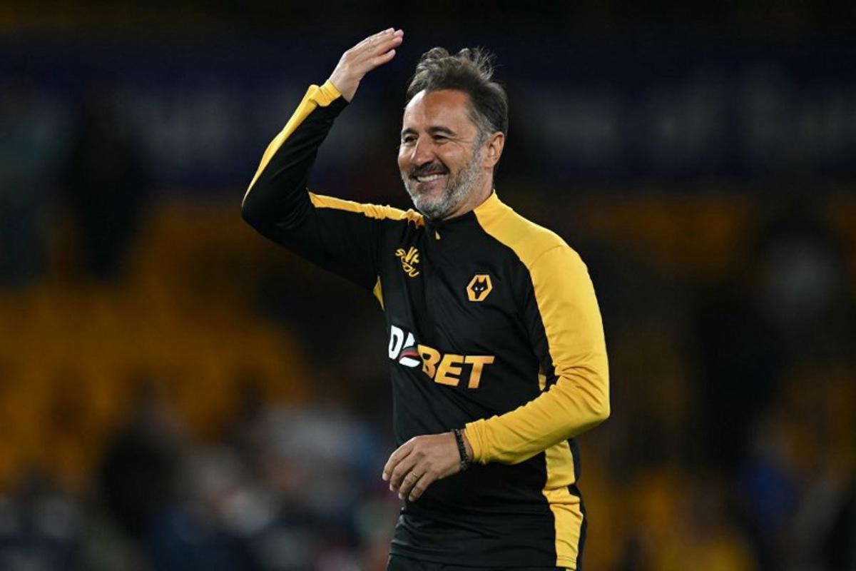 Wolverhampton Wanderers' Portuguese head coach Vitor Pereira celebrates on the pitch after the English League cup second round football match between Wolverhampton Wanderers and West Ham United at the Molineux stadium in Wolverhampton, central England on August 26, 2025. Wolves won the game 3-2. Paul ELLIS / AFP