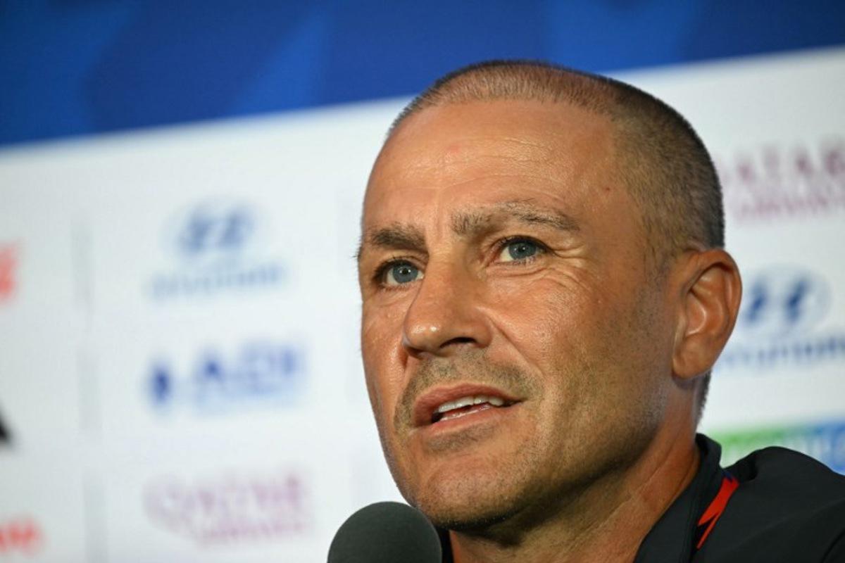 Uzbekistan's Italian head coach Fabio Cannavaro gives a press conference on the eve of Uzbekistan's 2026 World Cup football tournament Group H football match against Portugal in Houston on June 22, 2026.  RONALDO SCHEMIDT / AFP