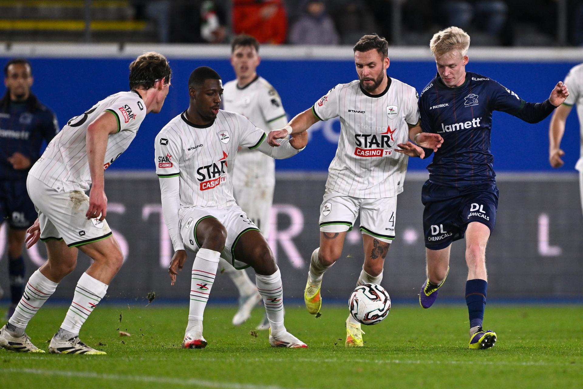 OHL's Ewoud Pletinckx, OHL's Roggerio Nyakossi, OHL's Birger Verstraete and Essevee's Jeppe Erenbjerg fight for the ball during a soccer match between Oud-Heverlee Leuven and Zulte Waregem, Sunday 07 December 2025 in Leuven, on day 17 of the 2025-2026 'Jupiler Pro League' first division of the Belgian championship. BELGA PHOTO JOHAN EYCKENS