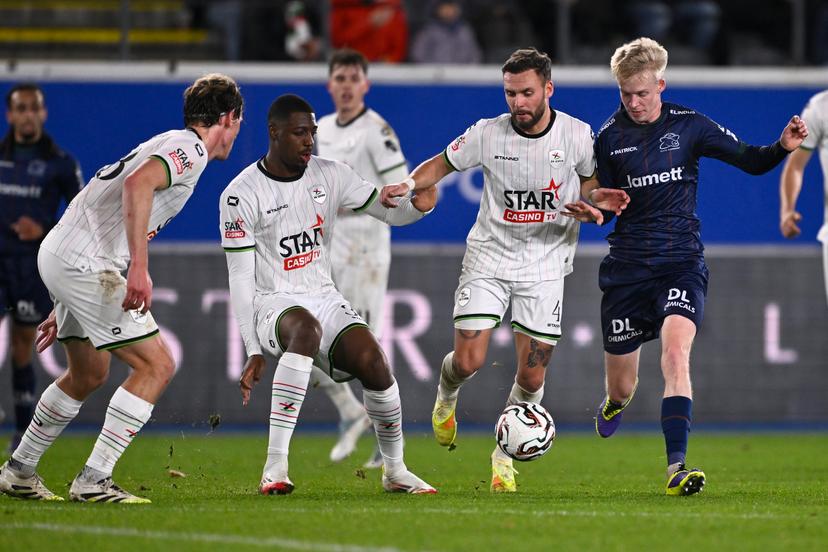 OHL's Ewoud Pletinckx, OHL's Roggerio Nyakossi, OHL's Birger Verstraete and Essevee's Jeppe Erenbjerg fight for the ball during a soccer match between Oud-Heverlee Leuven and Zulte Waregem, Sunday 07 December 2025 in Leuven, on day 17 of the 2025-2026 'Jupiler Pro League' first division of the Belgian championship. BELGA PHOTO JOHAN EYCKENS