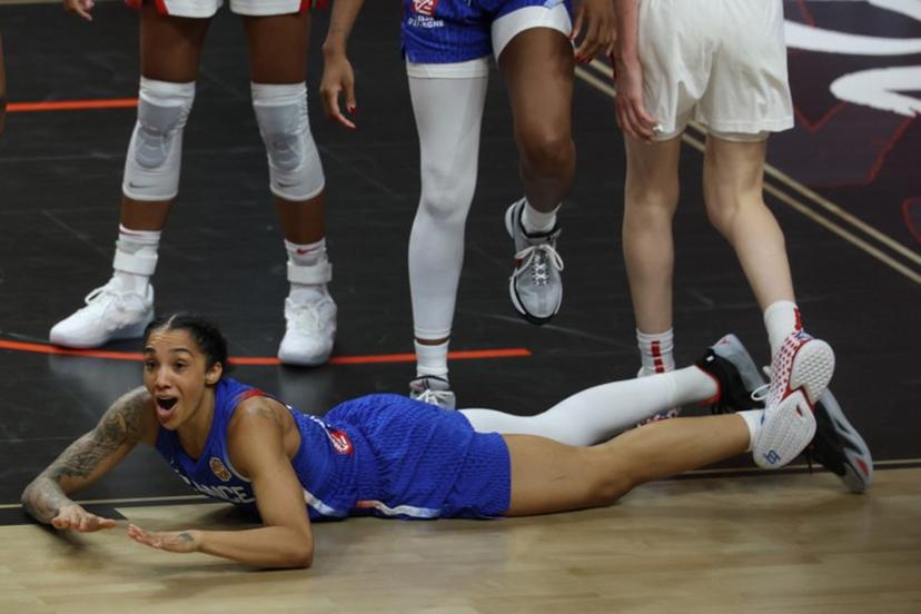 France's forward #15 Gabby Williams reacts as she lays on the pitch during the 2026 FIBA Women's Basketball World Cup final game between the United States and France in Berlin on September 13, 2026.  Odd ANDERSEN / AFP